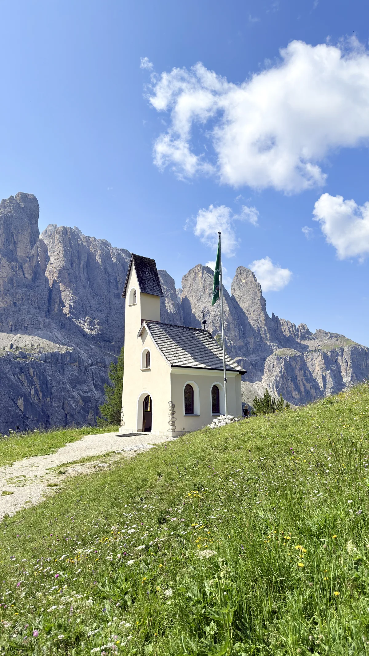 Cappella di San Maurizio with the Sella Group mountains in the background, at Passo Gardena, Dolomites