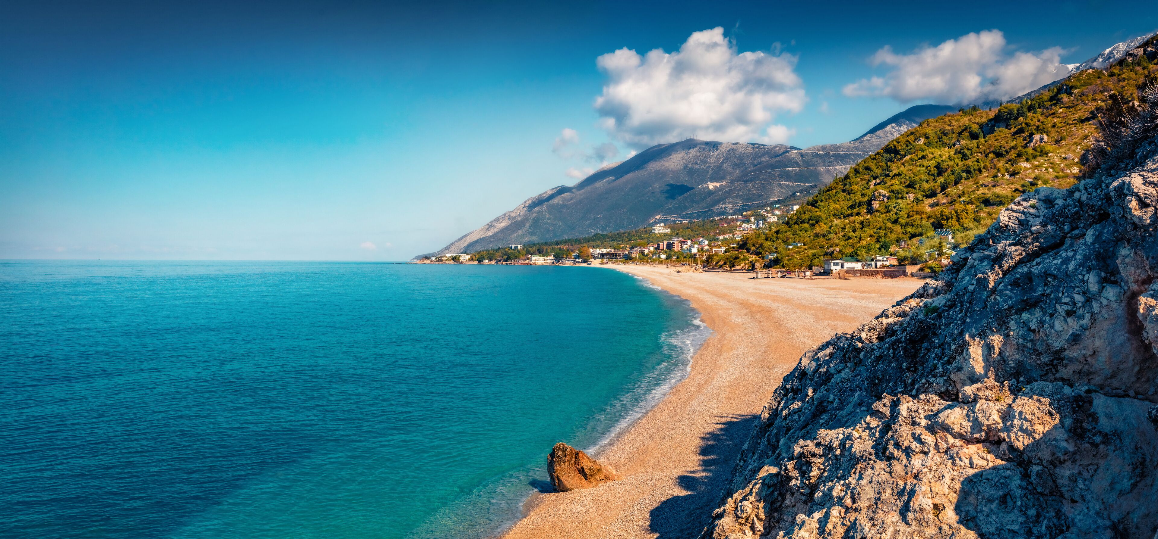 Dhërmi beach with clear blue waters on the Albanian Riviera, Albania