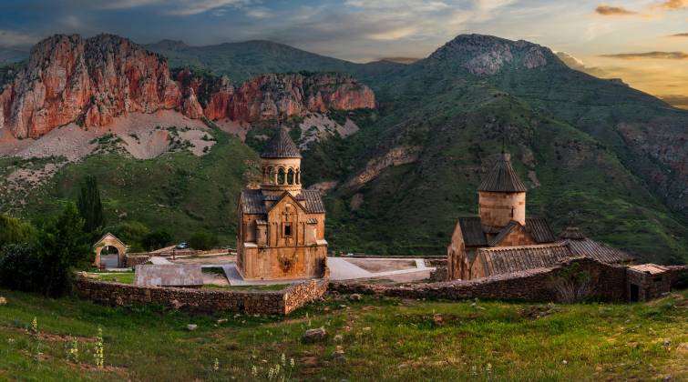 Noravank Monastery with its pink stone facade surrounded by red canyons, Vayots Dzor region, Armenia