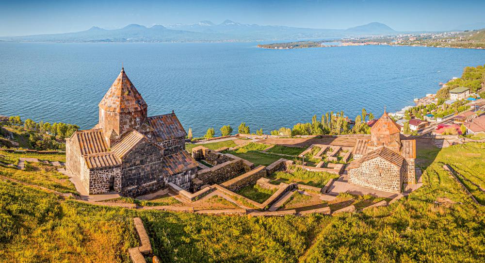 Sevanavank Monastery on the peninsula of Lake Sevan with the blue waters in the background, Armenia