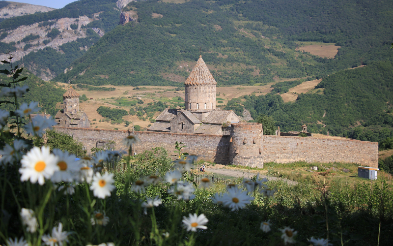 Tatev Monastery on top of a gorge with the Vorotan valley and mountains around it, southern Armenia