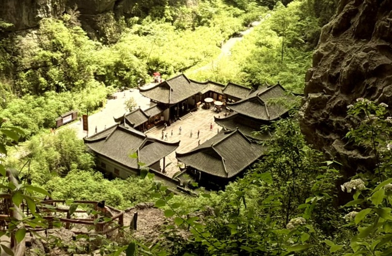 Traditional Chinese temple surrounded by green nature in Wulong, Chongqing