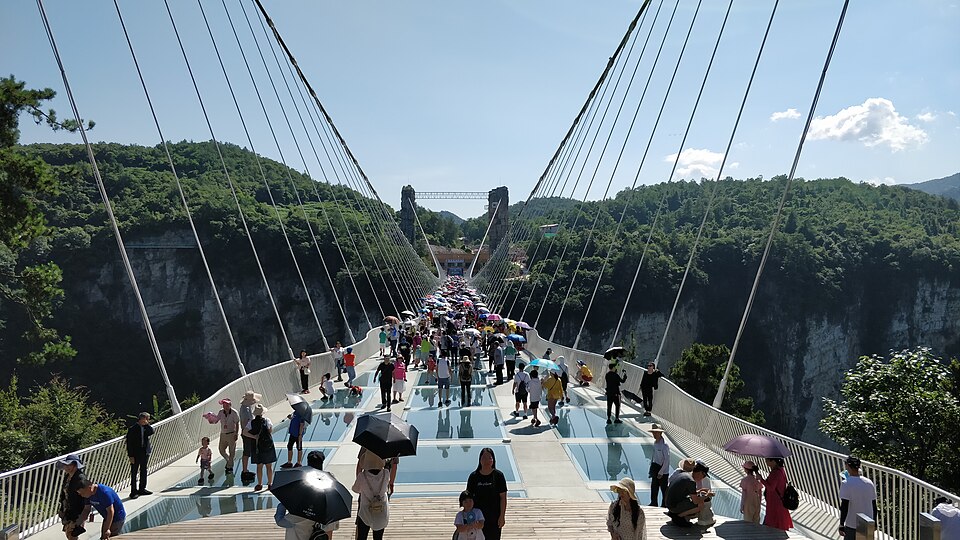 Zhangjiajie Glass Bridge suspended walkway over the Grand Canyon with valley views below